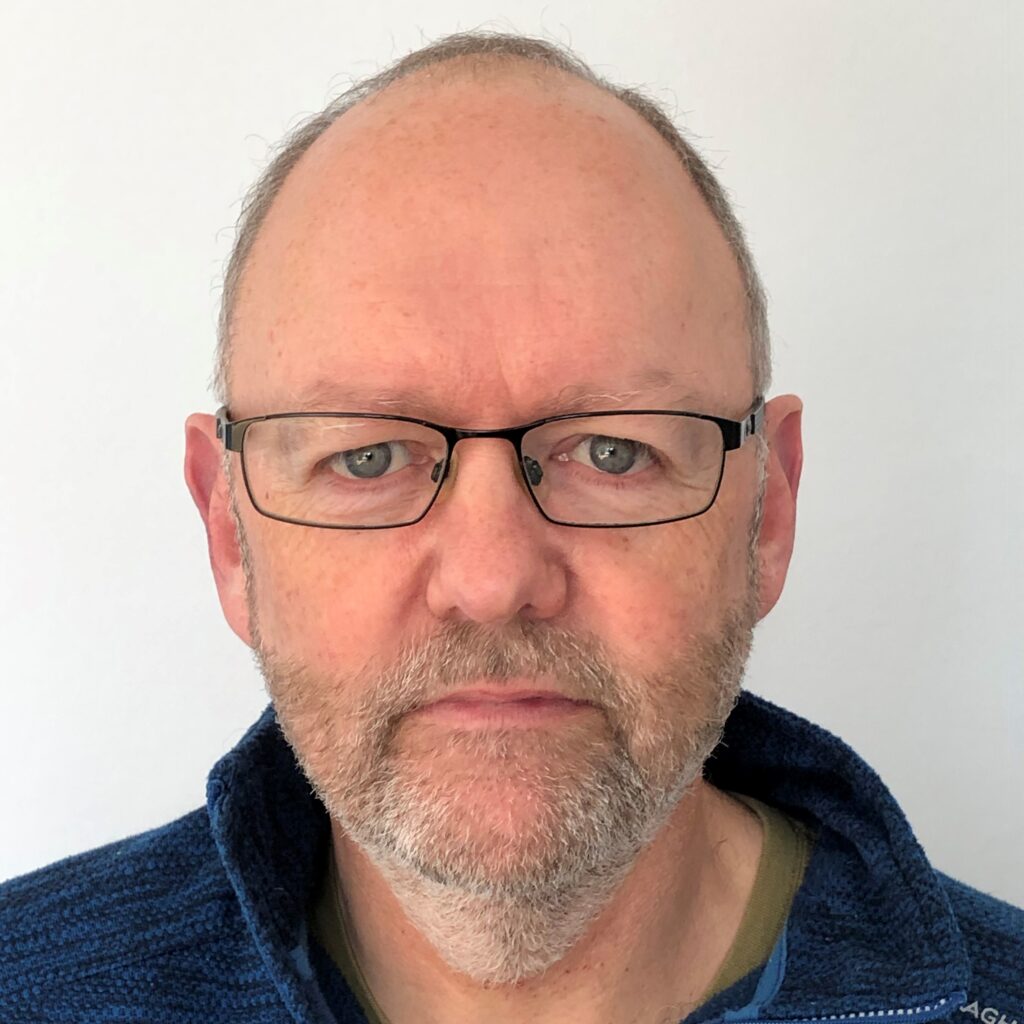 Man with glasses and a grey beard
